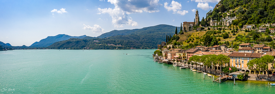 Luftaufnahme Morcote mit türkisblauem Seewasser, Kirche und mediterranem Flair im Tessin Südschweiz – Jan Geerk Fotograf Basel