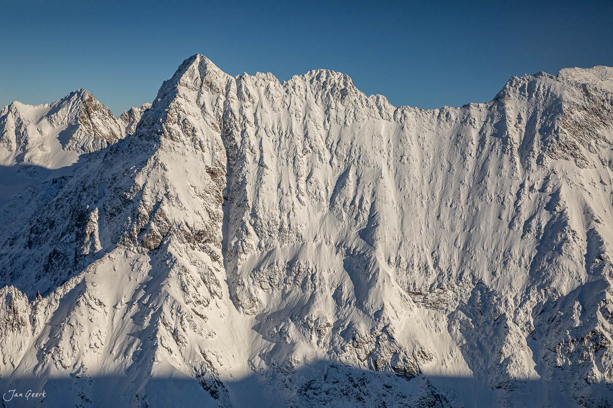 Schneebedeckte Gipfel Titlis Luftaufnahme Wintersonne Zentralschweiz Schweiz Jan Geerk Fotograf Basel